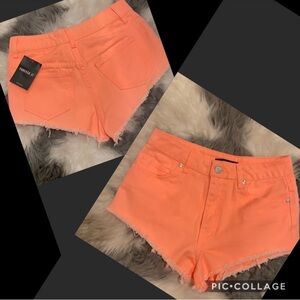Bright orange denim shorts
